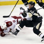 Pittsburgh Penguins' Patric Hornqvist (72) collides with Arizona Coyotes' Shane Doan (19) during the first period of an NHL hockey game in Pittsburgh Saturday, March 28, 2015. (AP Photo/Gene J. Puskar)
