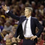 Golden State Warriors head coach Steve Kerr calls a play during the first half of Game 6 of basketball's NBA Finals against the Cleveland Cavaliers, in Cleveland, Tuesday, June 16, 2015. (AP Photo/Tony Dejak)
