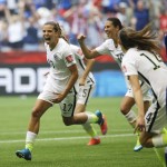 United States' Tobin Heath, left, celebrates after she scored a goal against Japan during the second half of the FIFA Women's World Cup soccer championship in Vancouver, British Columbia, Canada, Sunday, July 5, 2015. (AP Photo/Elaine Thompson)
