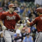 Arizona Diamondbacks' Paul Goldschmidt receives congratulations from David Peralta after his home run against the Milwaukee Brewers during the first inning of a baseball game Sunday, May 31, 2015, in Milwaukee. (AP Photo/Jeffrey Phelps)