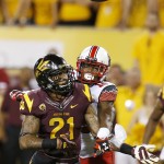 Utah's Justin Thomas (12) breaks up a pass intended for Arizona State's Jaelen Strong (21) in the first half of an NCAA college football game on Saturday, Nov. 1, 2014, in Tempe, Ariz. (Photo/Ross D. Franklin)