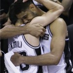  San Antonio Spurs guard Manu Ginobili, left, and forward Tim Duncan embrace in the final moments of Game 5 of the NBA basketball finals against the Miami Heat on Sunday, June 15, 2014, in San Antonio. San Antonio won the NBA championship 104-87. (AP Photo/Tony Gutierrez)