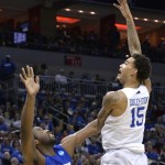 Kentucky's Willie Cauley-Stein, right, shoots over Hampton's Jervon Pressley during the second half of an NCAA tournament second round college basketball game in Louisville, Ky., Thursday, March 19, 2015. Kentucky won 79-56. (AP Photo/Timothy D. Easley)