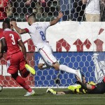 United States' Clint Dempsey, center, moves the ball past Panama goalie Jaime Penedo, right, to score during the first half of a friendly soccer match, Sunday, Feb. 8, 2015, in Carson, Calif. (AP Photo/Jae C. Hong)