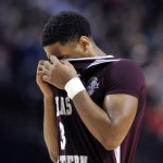 Texas Southern guard Madarious Gibbs pulls his jersey over his face during the second half of an NCAA college basketball second round game against Arizona in Portland, Ore., Thursday, March 19, 2015. Arizona won 93-72. (AP Photo/Greg Wahl-Stephens)