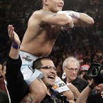 Marcos Maidana, from Argentina, celebrates at the end of his WBC-WBA welterweight title boxing fight against Floyd Mayweather Jr., Saturday, May 3, 2014, in Las Vegas. Mayweather won the bout by majority decision. (AP Photo/Isaac Brekken)