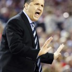 Kentucky head coach John Calipari works the sideline against Connecticut during the first half of the NCAA Final Four tournament college basketball championship game Monday, April 7, 2014, in Arlington, Texas. (AP Photo/David J. Phillip)