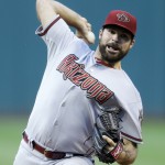 Arizona Diamondbacks starting pitcher Josh Collmenter delivers in the first inning of a baseball game against the Cleveland Indians, Tuesday, Aug. 12, 2014, in Cleveland. (AP Photo/Tony Dejak)
