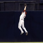 Arizona Diamondbacks center fielder A.J. Pollock makes a leaping catch at the wall, robbing the San Diego Padres' Rene Rivera of a hit, during the third inning of a baseball game Thursday, Sept. 4, 2014, in San Diego. (AP Photo/Gregory Bull)