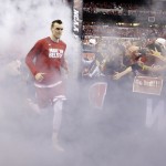 Wisconsin's Sam Dekker runs to the court before the NCAA Final Four college basketball tournament championship game against Duke Monday, April 6, 2015, in Indianapolis. (AP Photo/Michael Conroy)