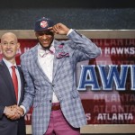 Michigan State's Adreian Payne, right, poses for a photo with NBA commissioner Adam Silver after being selected as the 15th overall pick by the Atlanta Hawks during the 2014 NBA draft, Thursday, June 26, 2014, in New York. (AP Photo/Jason DeCrow)