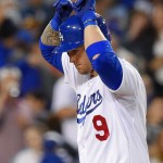 Los Angeles Dodgers' Yasmani Grandal celebrates as he scores after hitting a solo home run during the third inning of a baseball game against the Arizona Diamondbacks, Wednesday, June 10, 2015, in Los Angeles. (AP Photo/Mark J. Terrill)