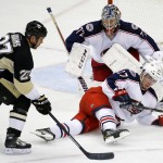 Pittsburgh Penguins' Craig Adams (27) can't get to a loose puck in front of Columbus Blue Jackets' Ryan Murray (27) and goalie Sergei Bobrovsky (72) during the third period of a first-round NHL playoff hockey game in Pittsburgh on Wednesday, April 16, 2014. The Penguins won 4-3. (AP Photo/Gene J. Puskar)
