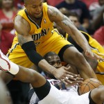 Atlanta Hawks forward Paul Millsap, bottom, and Indiana Pacers forward David West, top, battle for a loose ball in the first half of Game 6 of a first-round NBA basketball playoff series in Atlanta, Thursday, May 1, 2014. (AP Photo/John Bazemore)