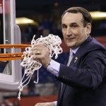 Duke head coach Mike Krzyzewski cuts down the net after his team's 68-63 victory over Wisconsin in the NCAA Final Four college basketball tournament championship game Monday, April 6, 2015, in Indianapolis. (AP Photo/David J. Phillip)