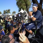 Dallas Cowboys quarterback Tony Romo, right, gives a news conference about his recovery from back surgery at the end of NFL football training camp on Thursday, July 24, 2014, in Oxnard, Calif. (AP Photo/Gus Ruelas)