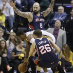 Indiana Pacers' Paul George (24) is defended by Atlanta Hawks' Pero Antic (6) and Kyle Korver (26) during the first half in Game 2 of an opening-round NBA basketball playoff series Tuesday, April 22, 2014, in Indianapolis. (AP Photo/Darron Cummings)