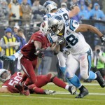 Carolina Panthers' Jonathan Stewart (28) runs past Arizona Cardinals' Rashad Johnson (26) for a touchdown in the first half of an NFL wild card playoff football game in Charlotte, N.C., Saturday, Jan. 3, 2015. (AP Photo/Mike McCarn)