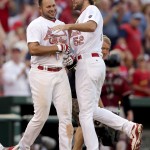 St. Louis Cardinals' Jhonny Peralta, left, is congratulated by teammate Michael Wacha after hitting a walk-off solo home run during the 10th inning of a baseball game against the Arizona Diamondbacks Monday, May 25, 2015, in St. Louis. The Cardinals won 3-2. (AP Photo/Jeff Roberson)