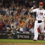  Washington Nationals' Bryce Harper pumps his fist as he scores the winning run on a single by Anthony Rendon during the ninth inning of a baseball game against the Arizona Diamondbacks on Wednesday, Aug. 20, 2014, in Washington. The Nationals defeated the Diamondbacks 3-2. (AP Photo/Evan Vucci)