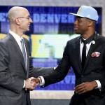Emmanuel Mudiay, right,is greeted by NBA Commissioner Adam Silver after being selected seventh overall by the Denver Nuggets during the NBA basketball draft, Thursday, June 25, 2015, in New York. (AP Photo/Kathy Willens)
