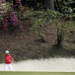  John Senden, of Australia, hits out of a bunker on the 12th hole during the fourth round of the Masters golf tournament Sunday, April 13, 2014, in Augusta, Ga. (AP Photo/Darron Cummings)