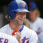 New York Mets Kirk Nieuwenhuis smiles in the dugout after hitting the second of his three home runs in a baseball game against the Arizona Diamondbacks in New York, Sunday, July 12, 2015. The first and second home runs came off Arizona Diamondbacks starting pitcher Rubby De La Rosa, while Diamondbacks relief pitcher Randall Delgado (48) allowed the third home run. (AP Photo/Kathy Willens)
