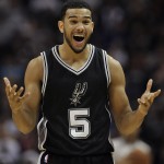 San Antonio Spurs guard Cory Joseph reacts to a call in the second half of an NBA basketball game against the Oklahoma City Thunder, Thursday, Dec. 25, 2014, in San Antonio. Oklahoma City won 114-106. (AP Photo/Darren Abate)