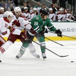 Arizona Coyotes' left wing Lauri Korpikoski (28) and center Antoine Vermette (50) defend as Dallas Stars' center Cody Eakin (20) tries to shoot in the first period of an NHL hockey game Wednesday, Dec. 31, 2014, in Dallas. (AP Photo/Sharon Ellman)
