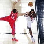 United States' Kenneth Faried, right, and Serbia's Rasko Katic vie for the ball during the final World Basketball match between the United States and Serbia at the Palacio de los Deportes stadium in Madrid, Spain, Sunday, Sept. 14, 2014. (AP Photo/Manu Fernandez)