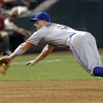 New York Mets' David Wright dives but is unable to come up with a ball hit by Arizona Diamondbacks' Martin Prado during the fifth inning of a baseball game Wednesday, April 16, 2014, in Phoenix. (AP Photo/Ross D. Franklin)