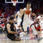 Arizona guard Gabe York (1) steals the ball from Stanford center Stefan Nastic during the second half of an NCAA college basketball game, Saturday, March 7, 2015, in Tucson, Ariz. (AP Photo/Rick Scuteri)