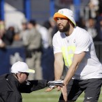 Indianapolis Colts Andrew Luck takes a snap during a practice session at Luke Air Force Base for the NFL Football Pro Bowl Thursday, Jan. 22, 2015, in Glendale, Ariz. (AP Photo/David J. Phillip)