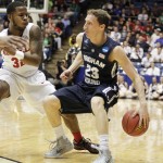Brigham Young's Skyler Halford (23) works the ball against Mississippi's Jarvis Summers in the first half of a first round NCAA tournament game Tuesday, March 17, 2015 in Dayton, Ohio. (AP Photo/Skip Peterson)