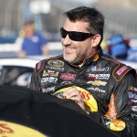 Driver Tony Stewart gets ready to qualify for Sunday's NASCAR Sprint Cup Series auto race on Friday, March 13, 2015, in Avondale, Ariz. (AP Photo/Rick Scuteri)