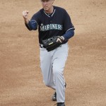 Actor Will Ferrell calls the runner out as he plays second base for the Seattle Mariners during the second inning of a spring training baseball game against the Oakland Athletics, Thursday, March 12, 2015, in Mesa, Ariz. The comedian plans to play every position while making appearances at five Arizona spring training games on Thursday. (AP Photo/Matt York)