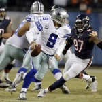 Dallas Cowboys quarterback Tony Romo (9) scrambles before throwing a touchdown pass to wide receiver Cole Beasley during the second half of an NFL football game against the Chicago Bears Thursday, Dec. 4, 2014, in Chicago. (AP Photo/Nam Y. Huh)