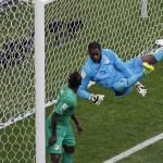 Ivory Coast's goalkeeper Boubacar Barry fails to stop a goal by Colombia's James Rodriguez during the group C World Cup soccer match between Colombia and Ivory Coast at the Estadio Nacional in Brasilia, Brazil, Thursday, June 19, 2014. (AP Photo/Themba Hadebe)