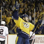 Nashville Predators center Colin Wilson, right, celebrates after scoring a goal against the Chicago Blackhawks during the third period of Game 5 of an NHL hockey first-round playoff series Thursday, April 23, 2015, in Nashville, Tenn. (AP Photo/Mark Humphrey)