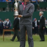 Rory McIlroy of Northern Ireland holds the Claret Jug trophy after winning the British Open Golf championship at the Royal Liverpool golf club, Hoylake, England, Sunday July 20, 2014. (AP Photo/Scott Heppell)