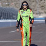 Danica Patrick walks along pit row before qualifications for Sunday's NASCAR Sprint Cup Series auto race, Friday, March 13, 2015, in Avondale, Ariz. (AP Photo/Rick Scuteri)