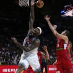 United States' DeMarcus Cousins vies for the ball against Serbia's Nemanja Bjelica during the final World Basketball match between the United States and Serbia at the Palacio de los Deportes stadium in Madrid, Spain, Sunday, Sept. 14, 2014. (AP Photo/Daniel Ochoa de Olza)