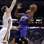 Phoenix Suns guard Eric Bledsoe (2) goes to the basket against New Orleans Pelicans center Omer Asik in the first half of an NBA basketball game in New Orleans, Friday, April 10, 2015. The Pelicans won 90-75. (AP Photo/Gerald Herbert)
