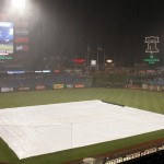 The field is covered as rain falls during the third inning of a baseball game between the Arizona Diamondbacks and the Philadelphia Phillies, Saturday, May 16, 2015, in Philadelphia. (AP Photo/Chris Szagola)