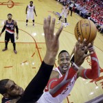 Portland Trail Blazers' LaMarcus Aldridge blocks a shot by Houston Rockets' Dwight Howard during the first half in Game 1 of an opening-round NBA basketball playoff series, Sunday, April 20, 2014, in Houston. (AP Photo/David J. Phillip)
