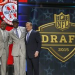 Nebraska defensive lineman Randy Gregory poses for photos with former the Dallas Cowboys player Darren Woodson, left, and NFL commissioner Roger Goodell after being selected by the Cowboys as the 60th pick in the second round of the 2015 NFL Football Draft, Friday, May 1, 2015, in Chicago. (AP Photo/Charles Rex Arbogast)