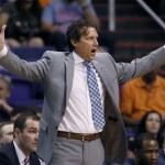 Utah Jazz coach Quin Snyder yells to the officials during the first half of the Jazz's NBA basketball game against the Phoenix Suns, Saturday, April 4, 2015, in Phoenix. (AP Photo/Matt York)