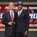 Elfrid Payton, right, poses for a photo with NBA commissioner Adam Silver after being selected as the 10th overall pick by the Philadelphia 76ers during the 2014 NBA draft, Thursday, June 26, 2014, in New York. (AP Photo/Jason DeCrow)