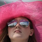Ali Shepard, of Alexandria Va., watches the infield before the 139th Preakness Stakes horse race at Pimlico Race Course, Saturday, May 17, 2014, in Baltimore. (AP Photo/Nick Wass)