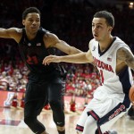 Arizona guard Gabe York (1) drives on Stanford forward Anthony Brown during the second half of an NCAA college basketball game, Saturday, March 7, 2015, in Tucson, Ariz. (AP Photo/Rick Scuteri)